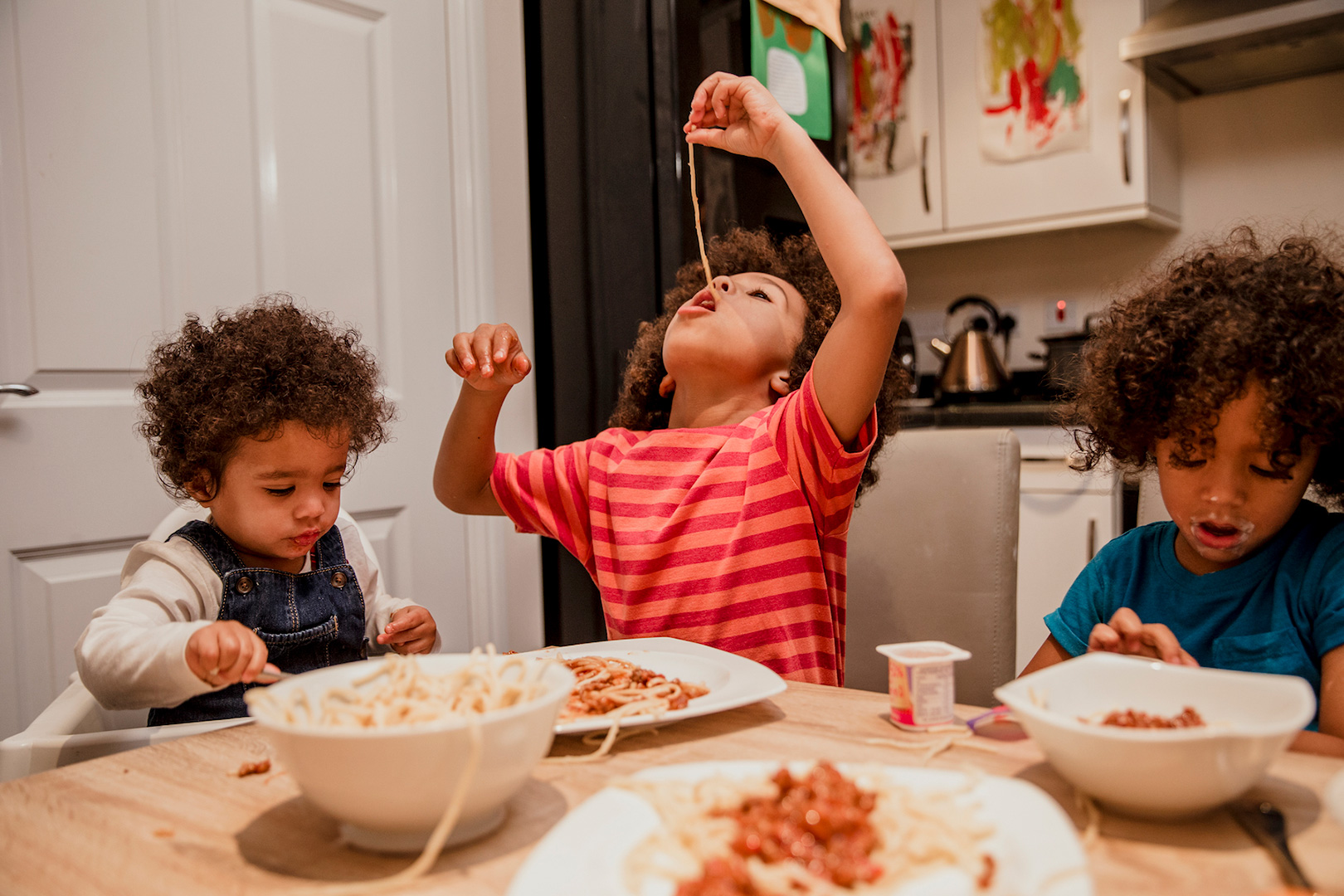 three-kids-eating-pasta_web